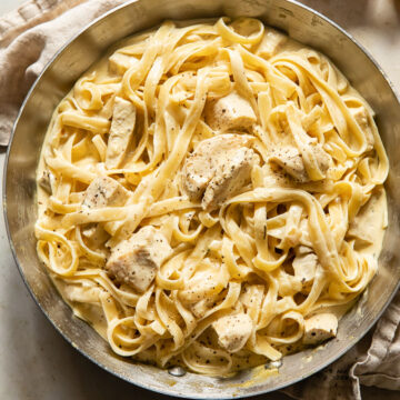 top down view of creamy chicken pasta in a pan