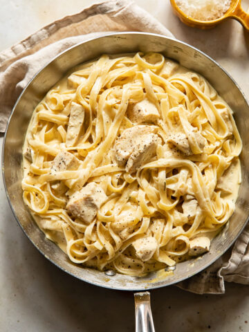 top down view of creamy chicken pasta in a pan