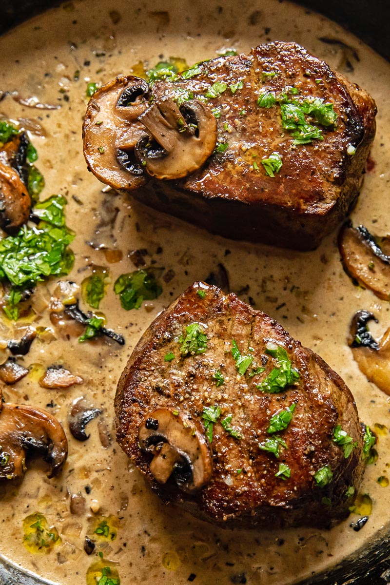 two fillet steaks in a creamy mushroom sauce