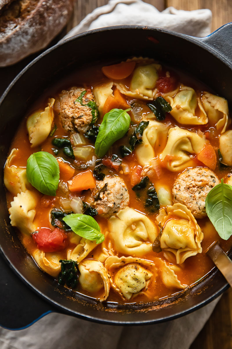 tortellini and meatball soup in a pot