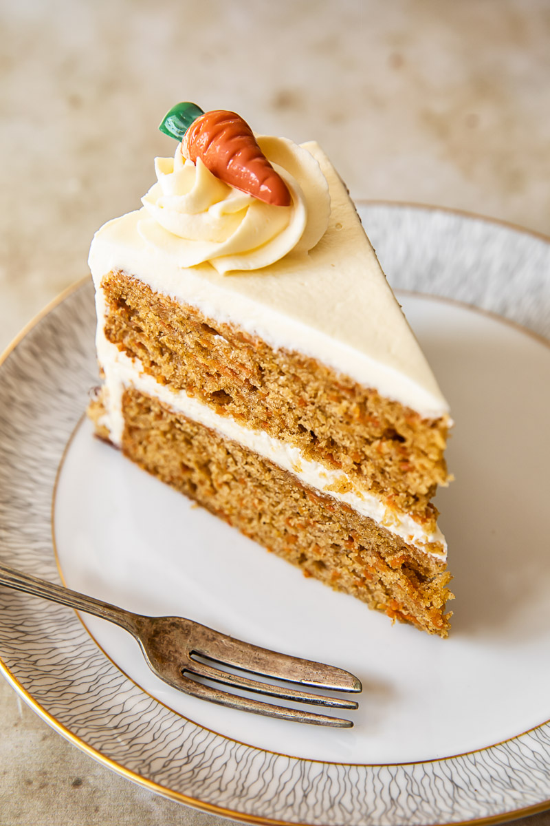 a slice of carrot cake on a plate