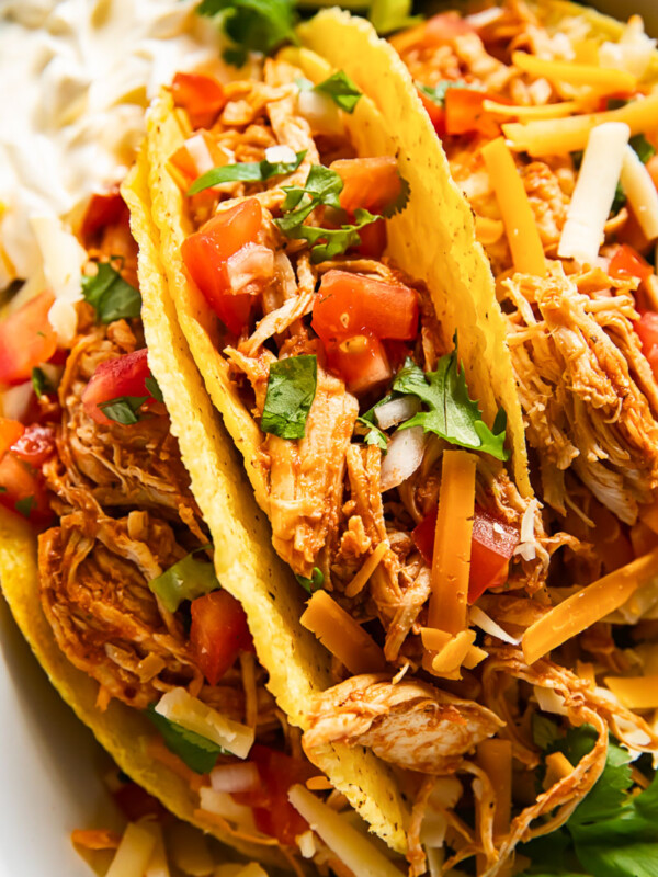 hard shell tacos filled with chicken and pico de gallo