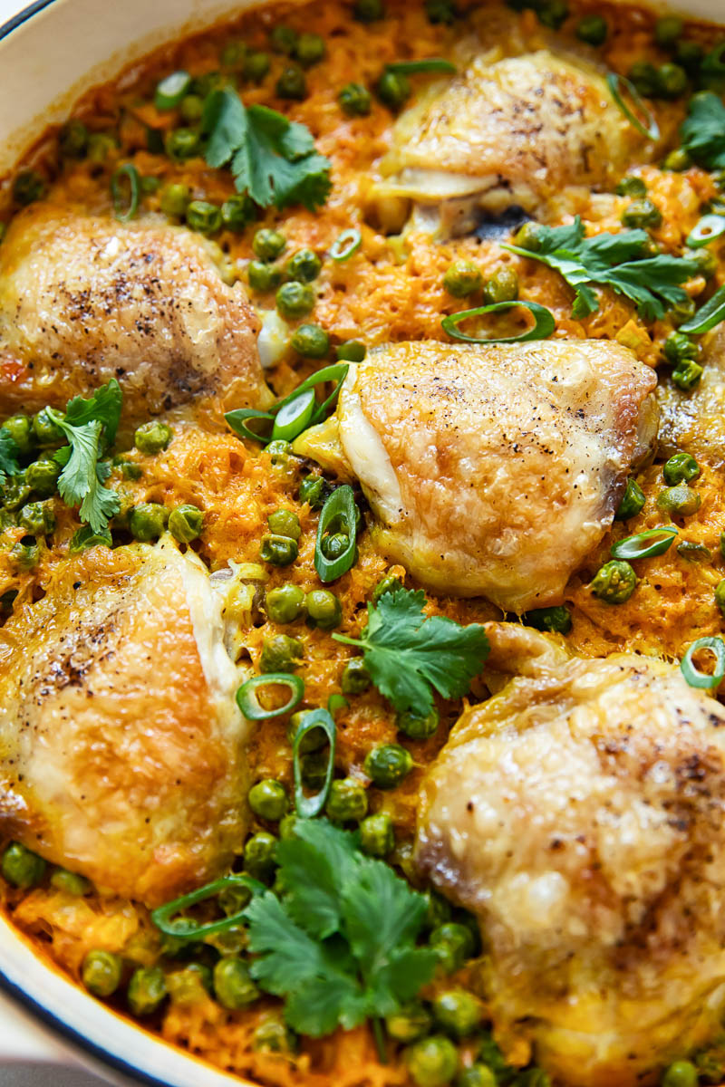 chicken thighs on top of rice in a pan