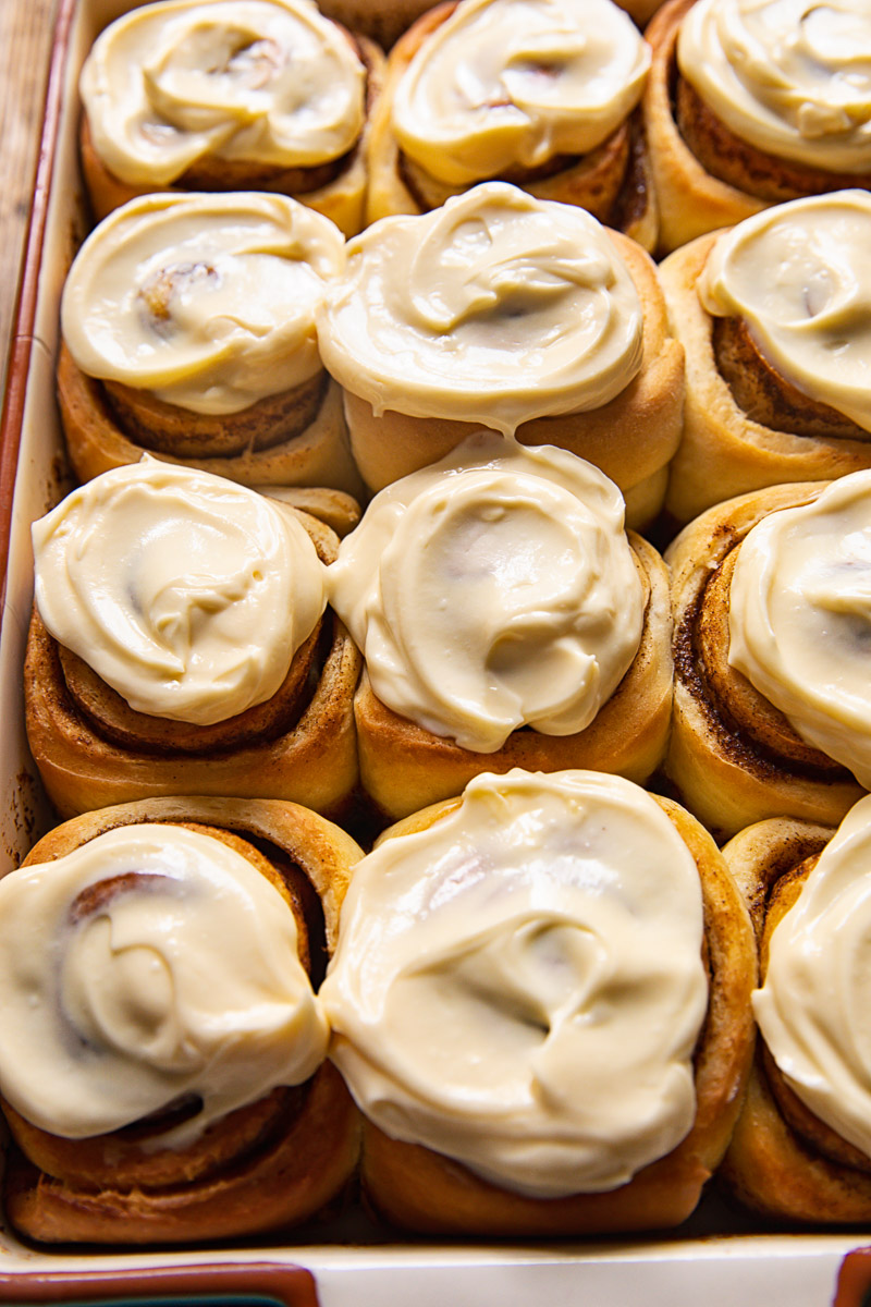 cinnamon rolls with icing in a pan