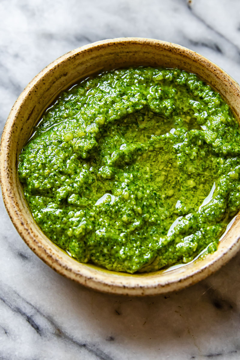 basil pesto in a beige bowl