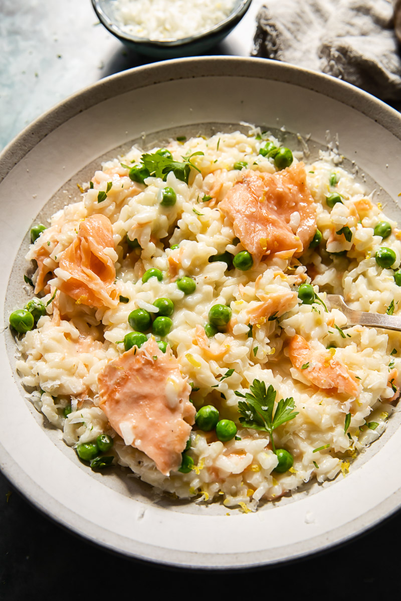 smoked salmon risotto with peas in a bowl