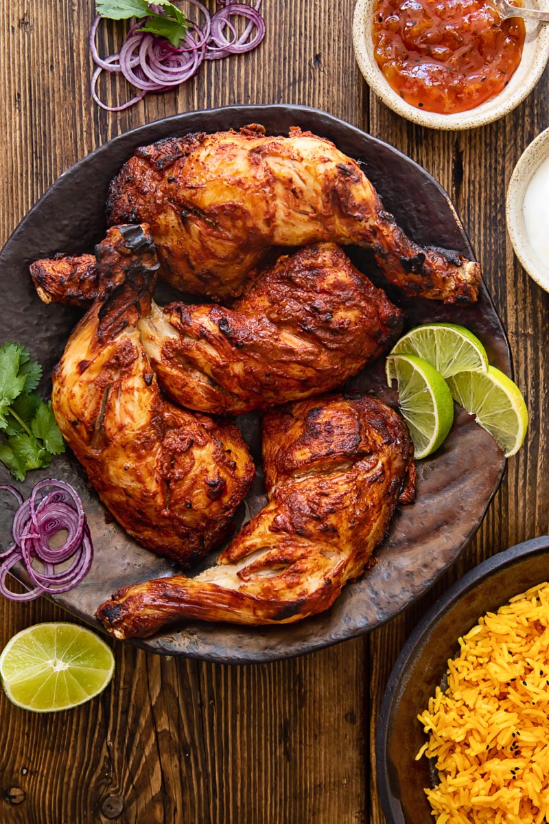 top down view of chicken legs on a brown platter