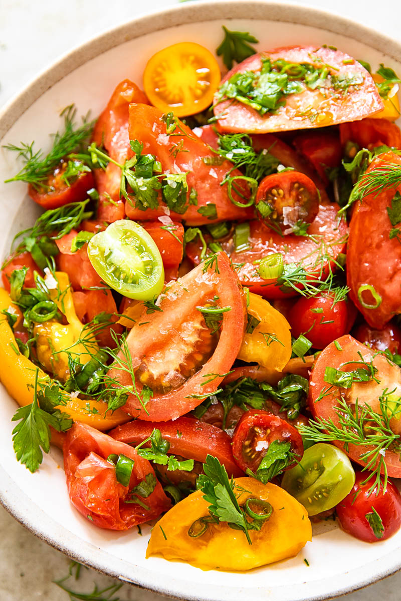 close up of tomato salad with herbs