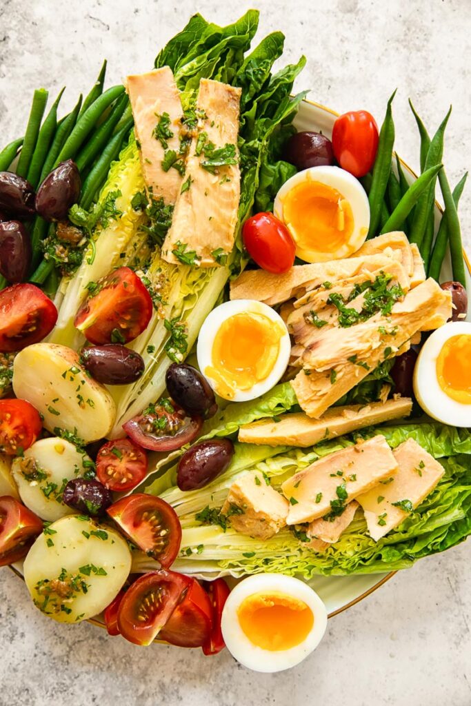 top down view of Nicoise salad on a platter