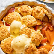 peach cobbler in a round pan