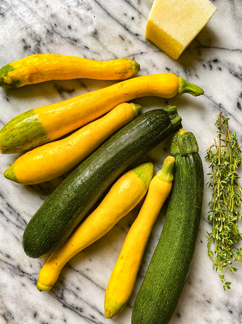 raw yellow and green zucchini, thyme, Pecorino