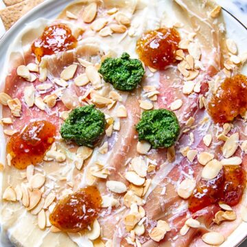 top down view of Parma ham topped with pesto, fig jam and almonds