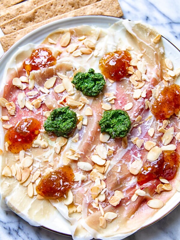 top down view of Parma ham topped with pesto, fig jam and almonds