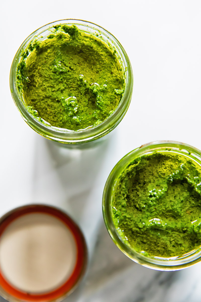 top down view of pesto in glass jars