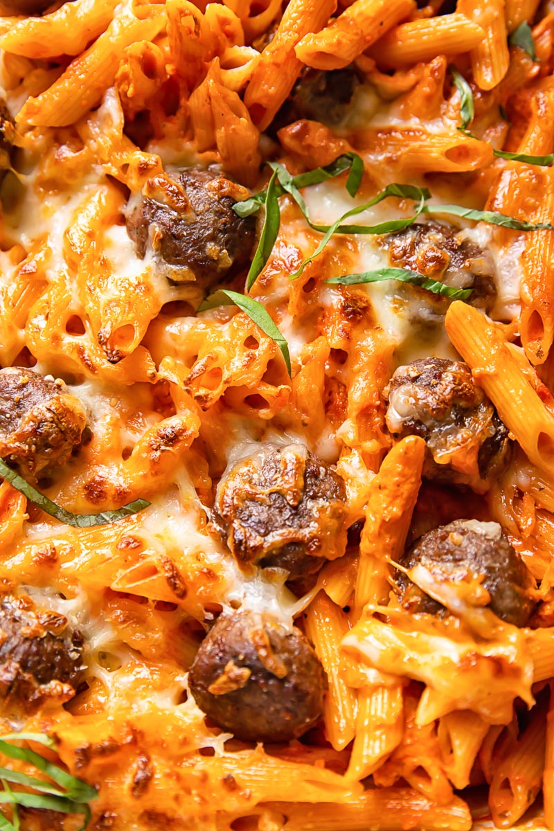 close up of baked pasta with meatballs