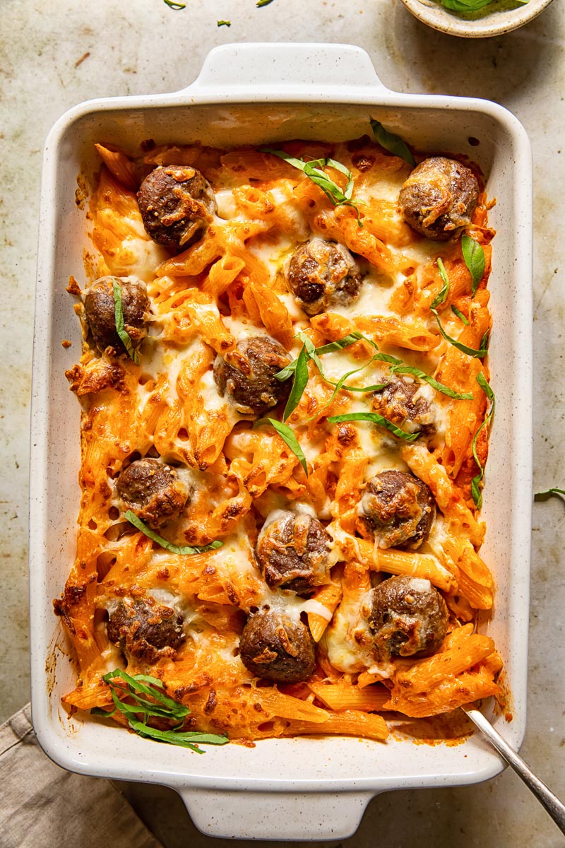 top down view of baked pasta with meatballs in a pan