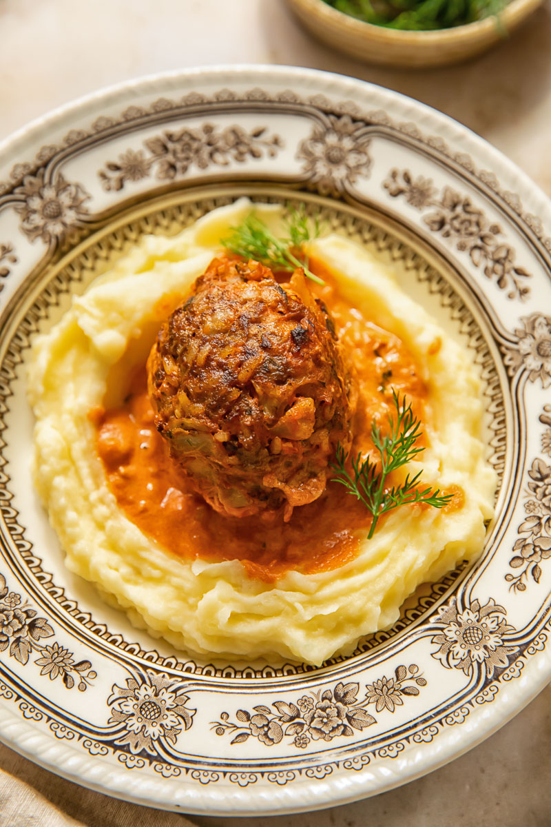 lazy cabbage roll on top of mashed potatoes in a bowl