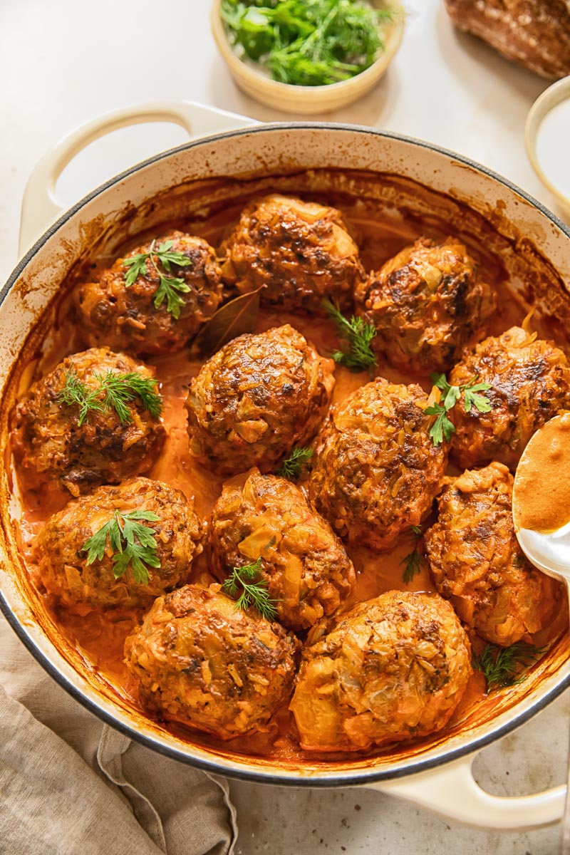 top down view of lazy cabbage rolls in tomato sauce in a white pan