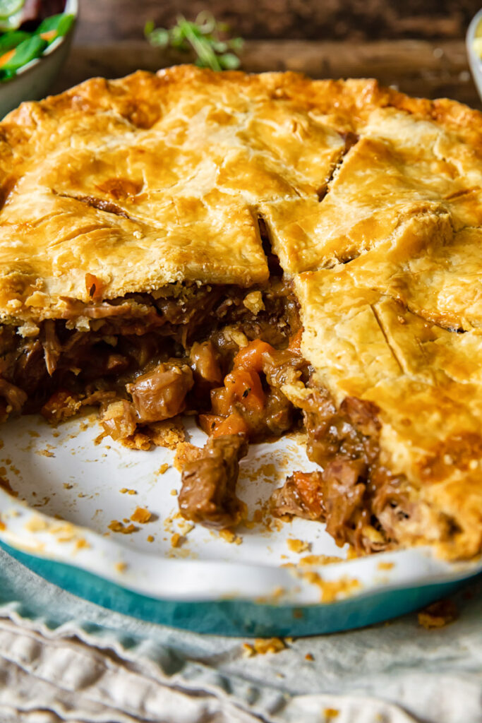 Steak and ale pie with piece removed