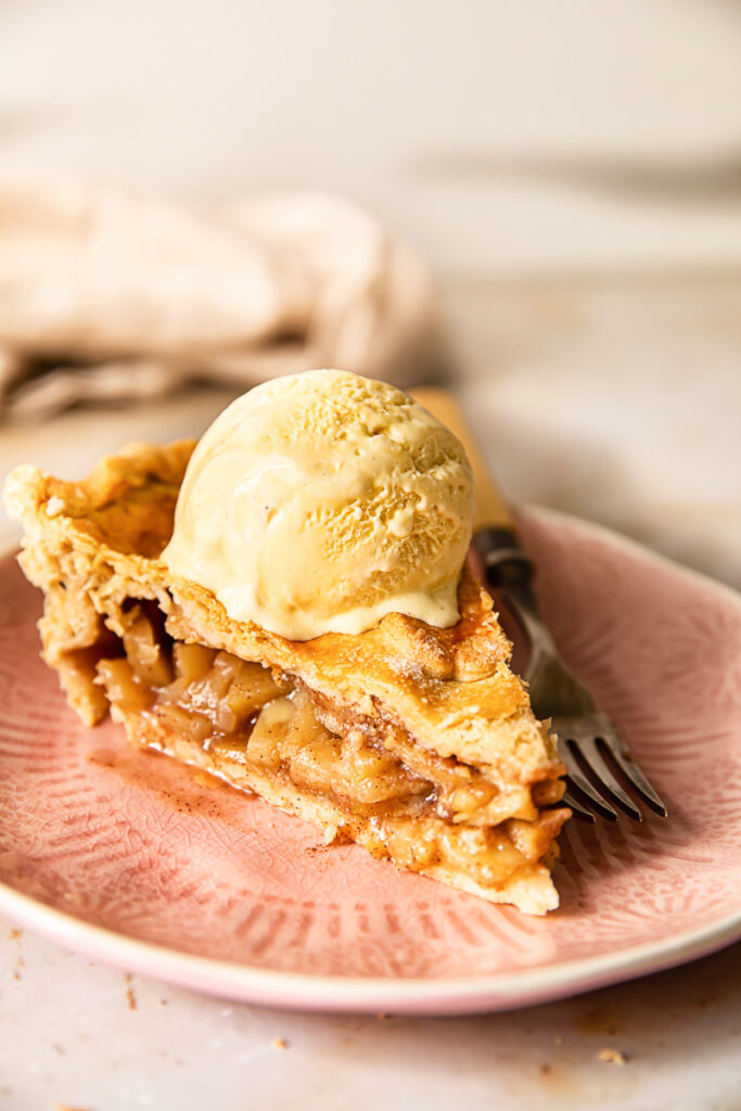 Slice of apple pie with ice cream
