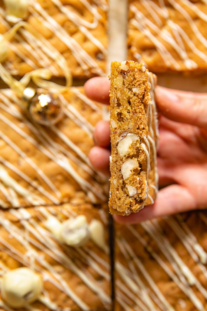 Hand holding hazelnut blondie