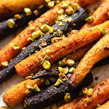 rainbow carrots sprinkles with pistachio nuts close up