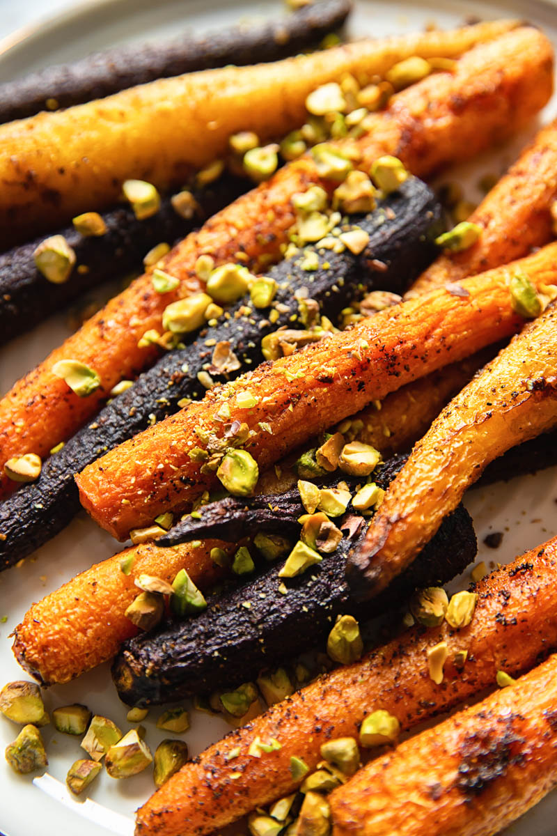 rainbow carrots sprinkles with pistachio nuts close up