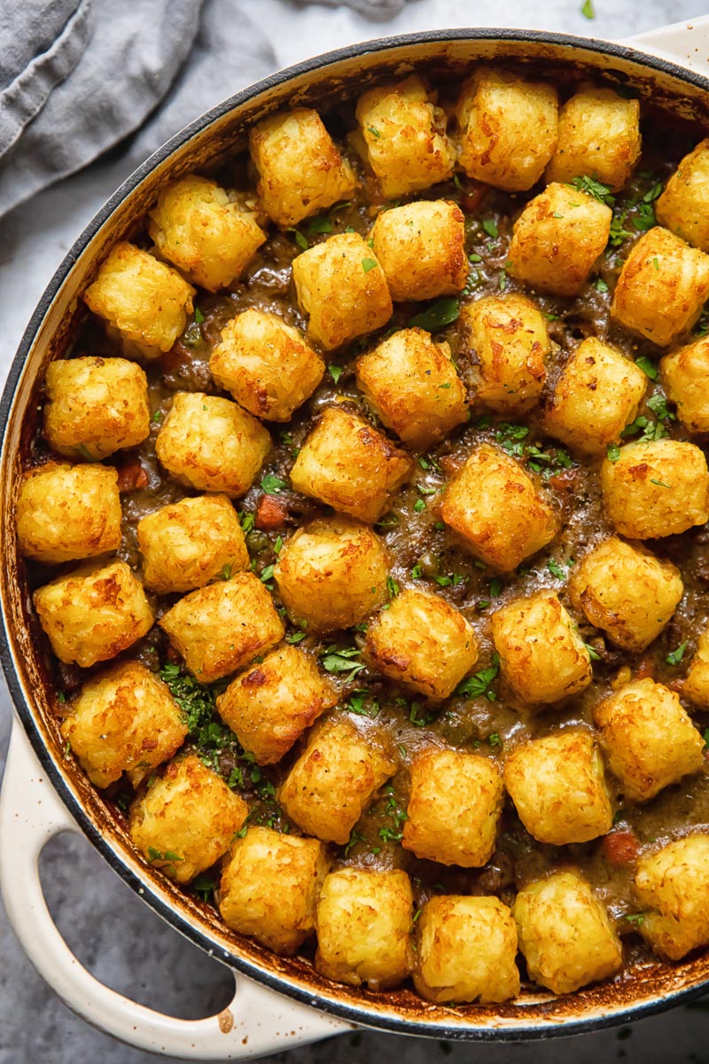 top down view of tater tot casserole in a round pan