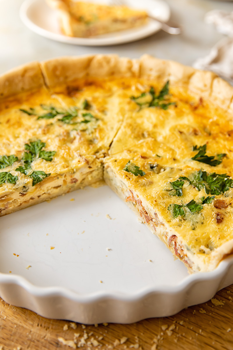 side view of a quiche with some slices taken out