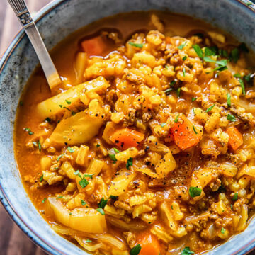 close up of a bowl of cabbage soup with beef