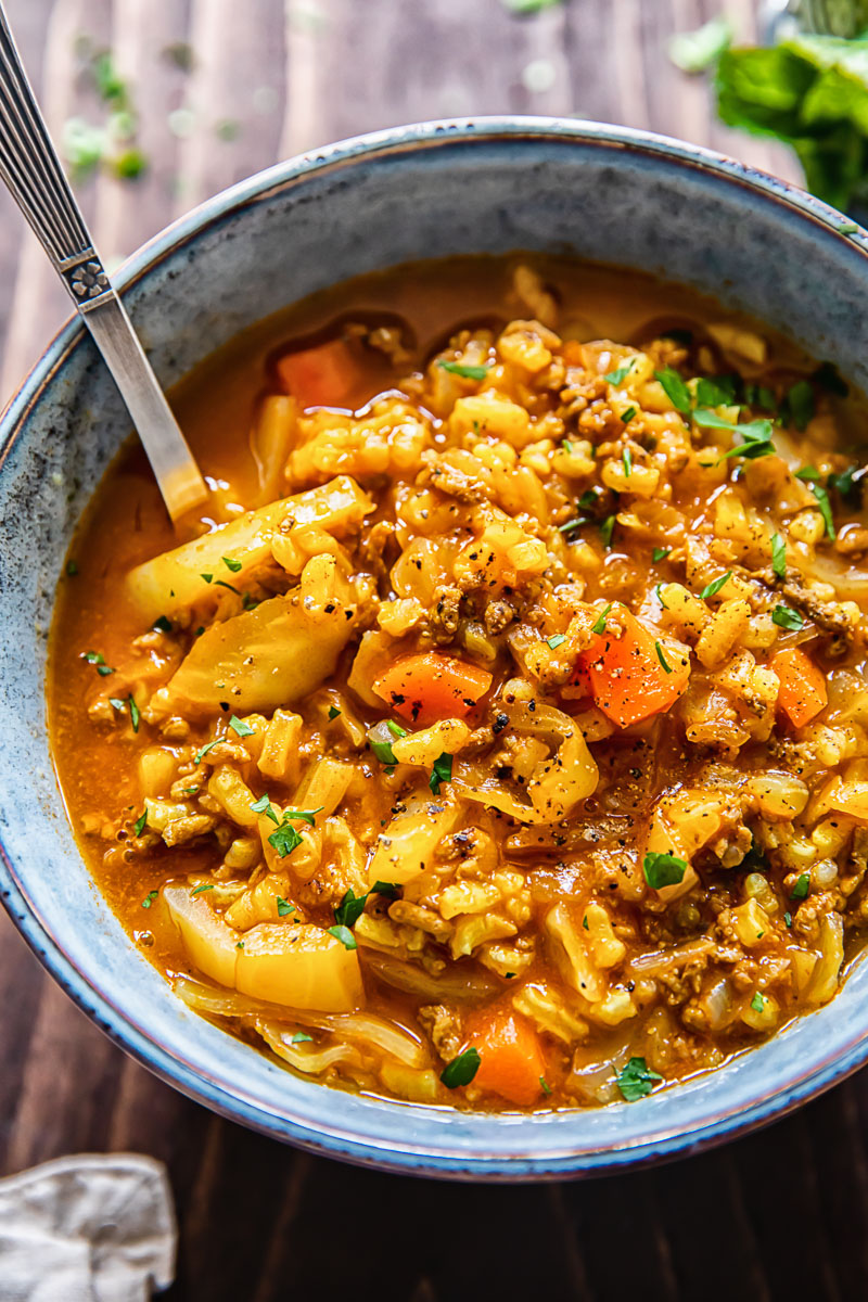 close up of a bowl of cabbage soup with beef