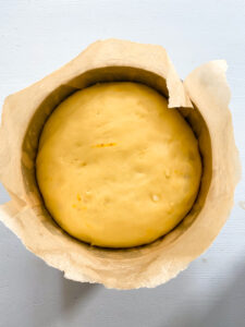 proved dough for Easter bread in a pan