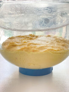 dough in a glass mixing bowl