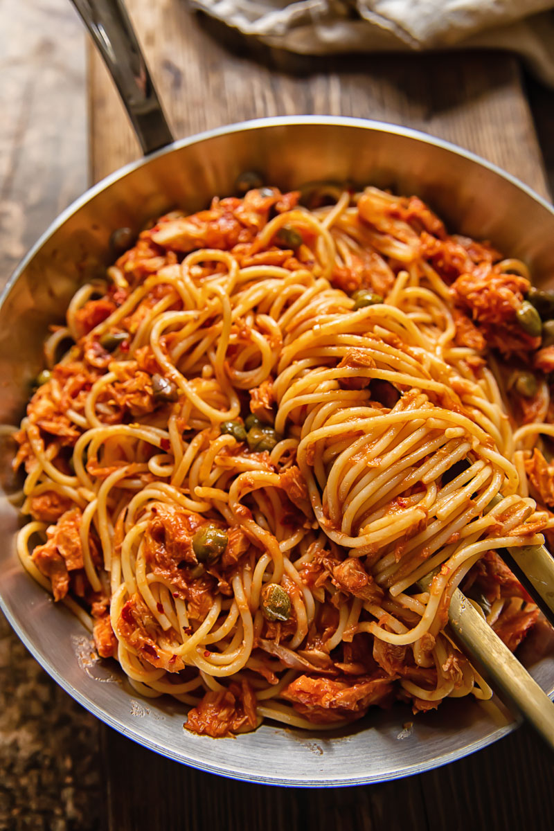 top down view of spaghetti in red sauce in a pan