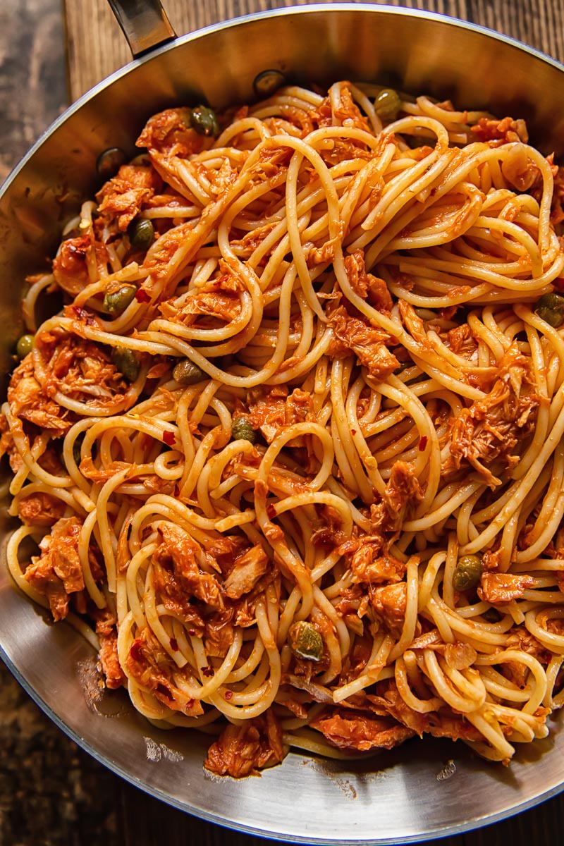 close up of spaghetti with tuna in a red sauce