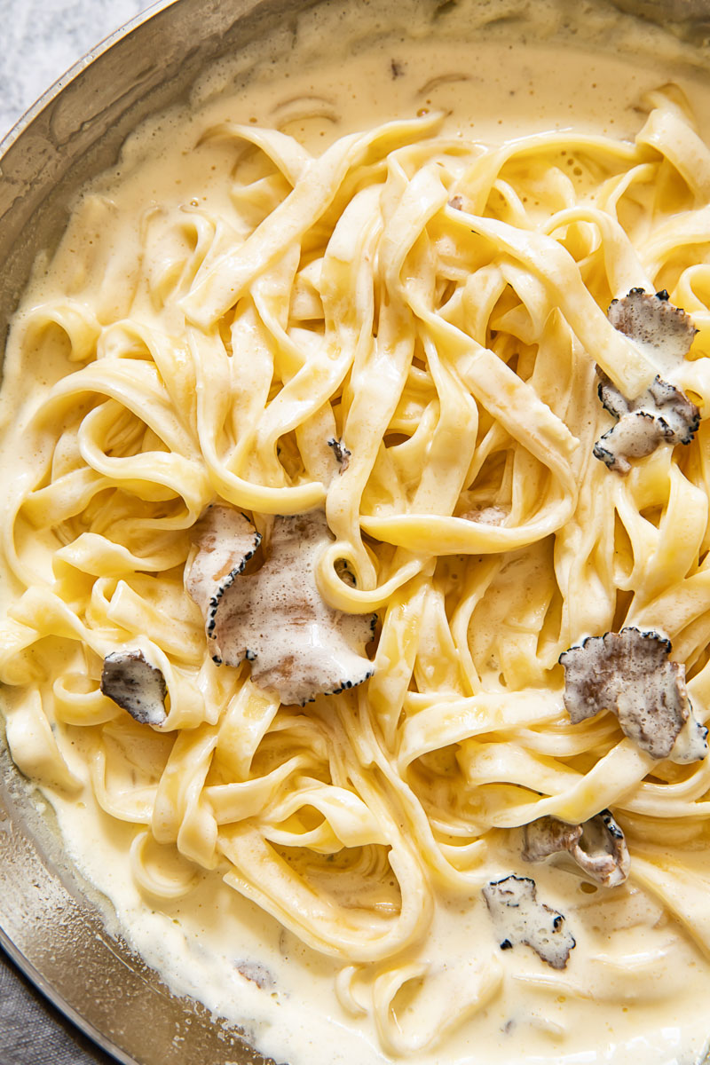 Close up of tagliatelle with truffle sauce in a pan