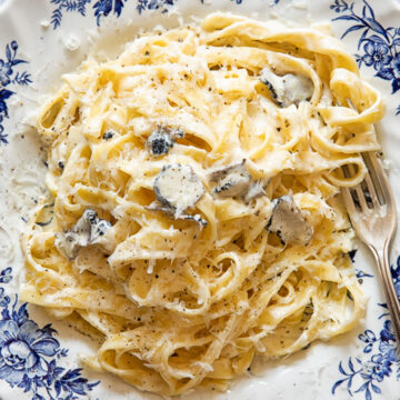 Top down view of tagliatelle pasta with truffle sauce on a plate