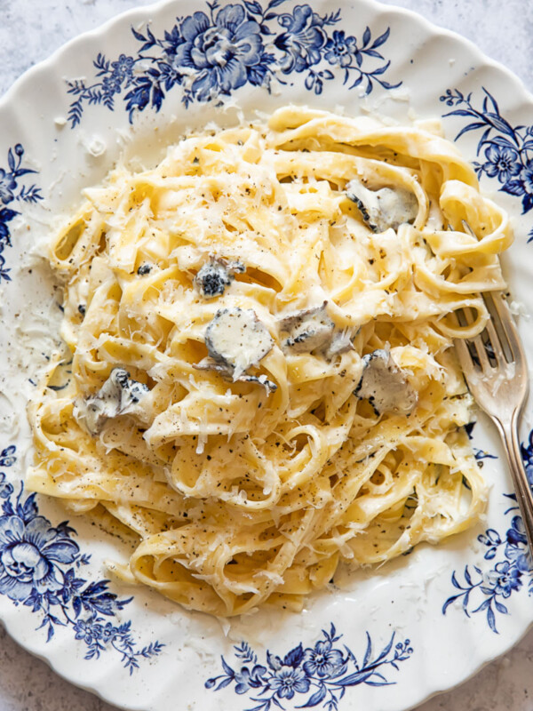 Top down view of tagliatelle pasta with truffle sauce on a plate