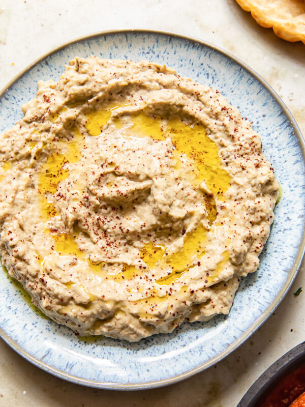 top down view of baba ganoush spread on blue plate