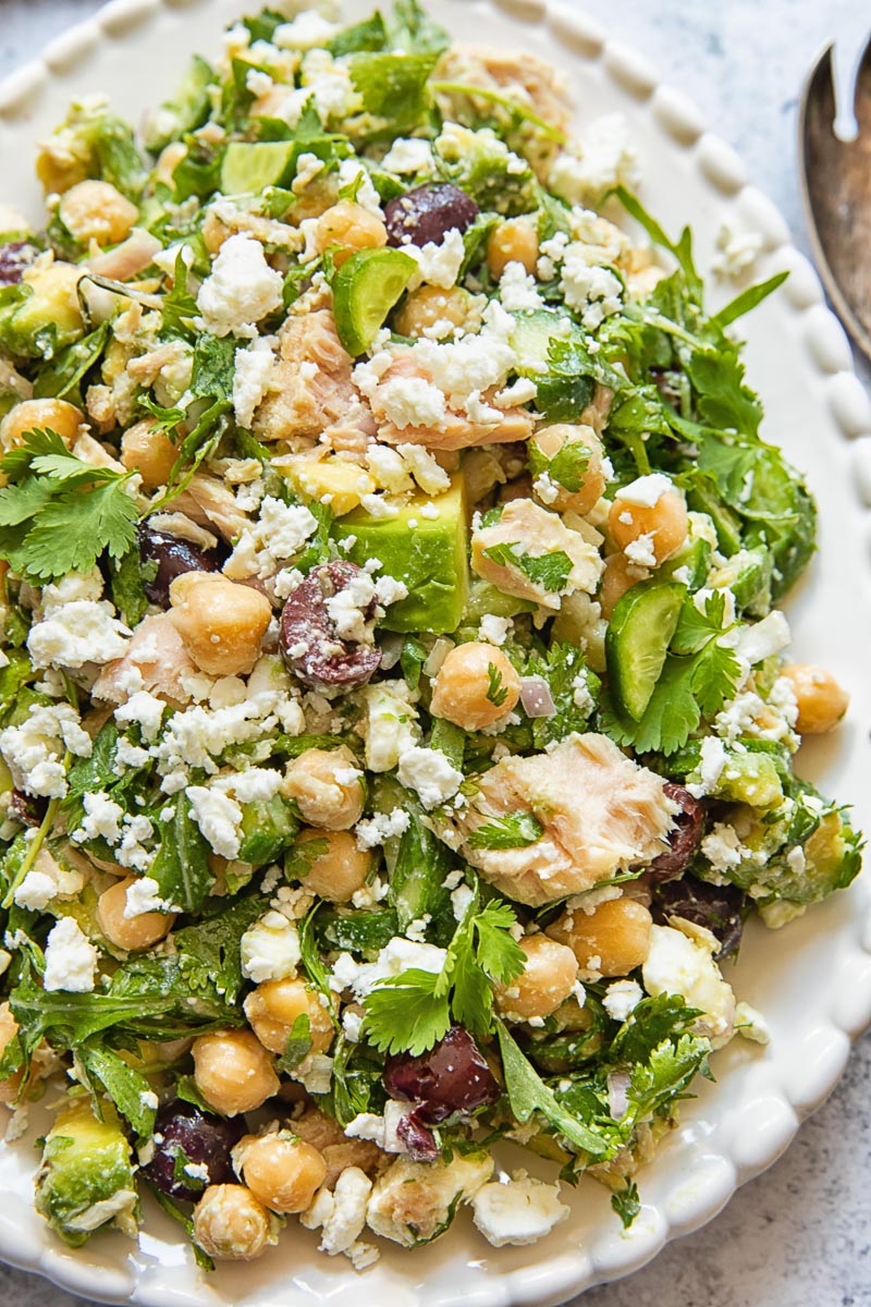 Close up of chickpea tuna salad with avocado and feta on a platter