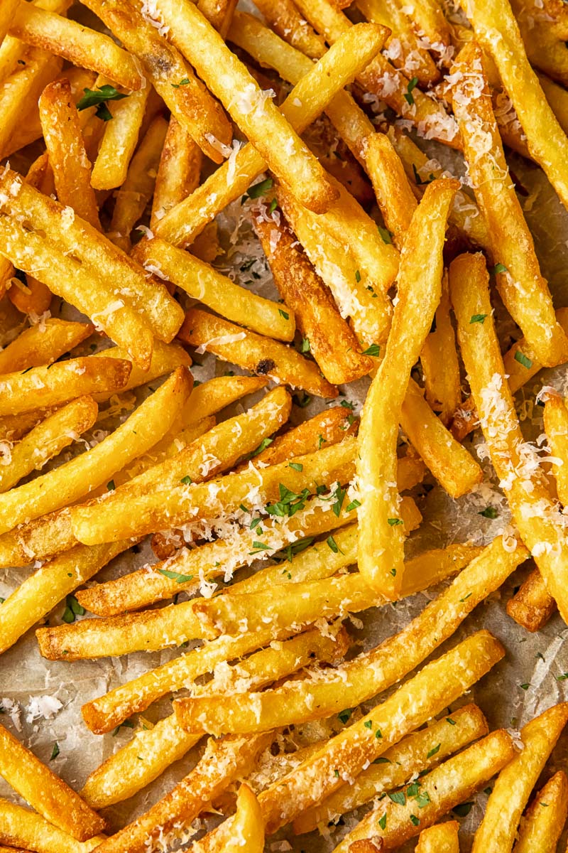 Close up shot of parmesan truffle fries on a tray