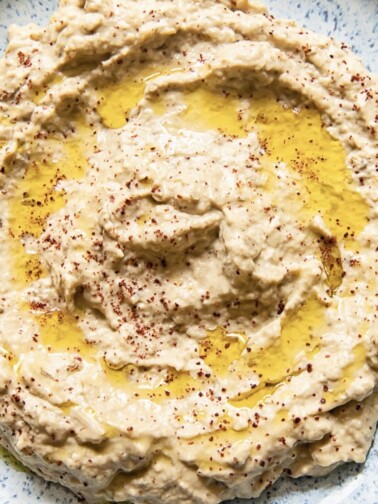 Plate of baba ganoush witih oil and sumac