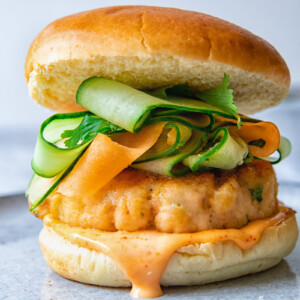 Salmon burger on a grey plate