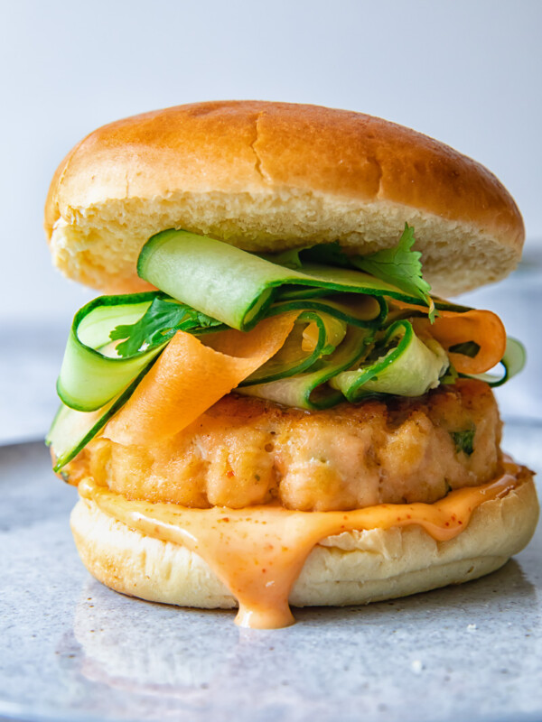 Salmon burger on a grey plate