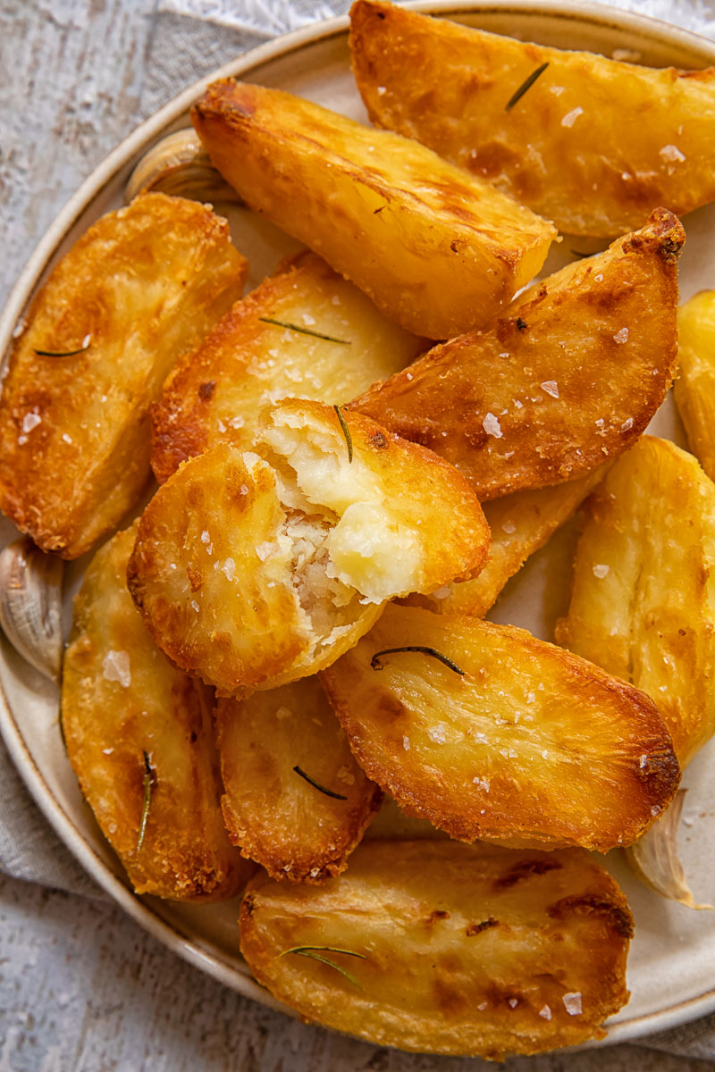 Close up view of roast potatoes on a plate