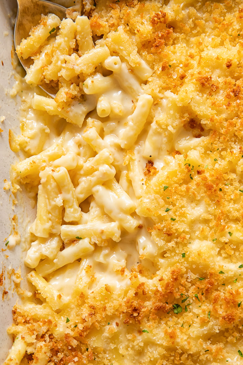 Close up view of truffle mac and cheese in a baking dish.
