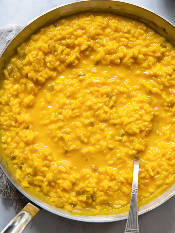 top down view of a pan of yellow saffron risotto