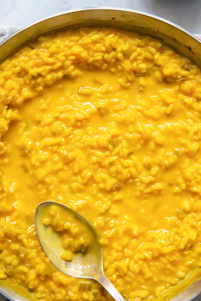 Close up of a pay of saffron risotto