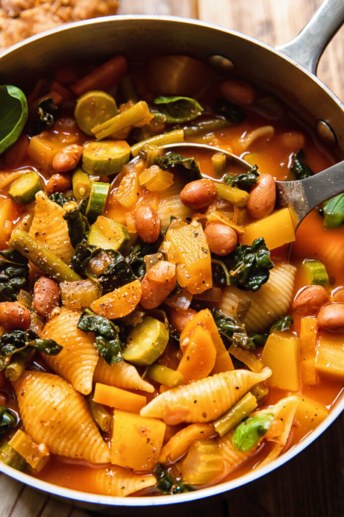 Soup pan with minestrone and a ladle