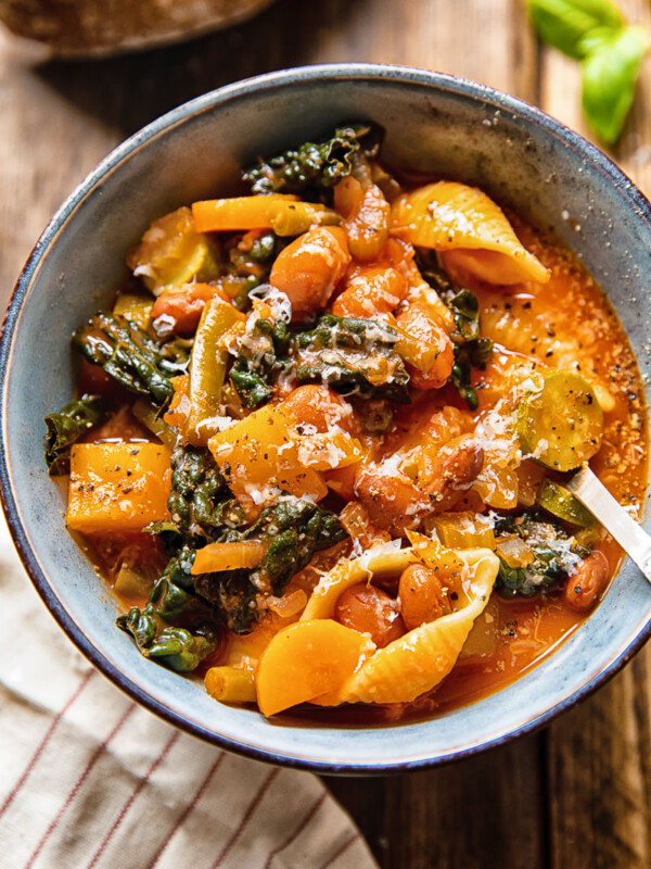 Bowl of minestrone soup with a spoon